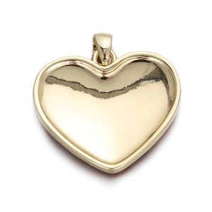 Detailed macro view of heart-shaped 14K gold plated pendant with polished mirror finish