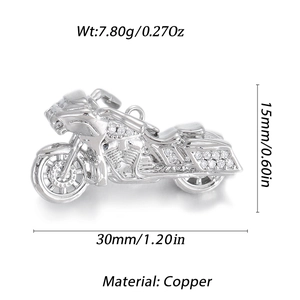 Macro detail of a silver copper motorcycle pendant with inlaid zircon for DIY jewelry
