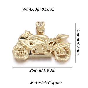 Macro detail of gold motorcycle pendant featuring copper material and CZ stone accents