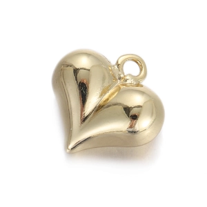 Macro detail of 3D heart-shaped gold-plated pendant with polished metallic finish