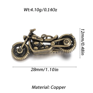 Detail shot of vintage copper motorcycle charm with measurements and weight specifications