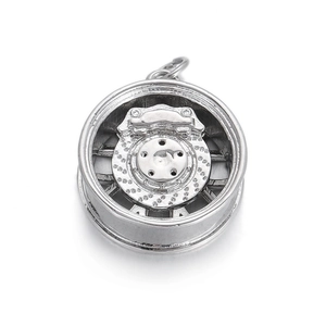 Macro detail of a 14K gold plated car wheel rim and brake disc pendant for DIY jewelry