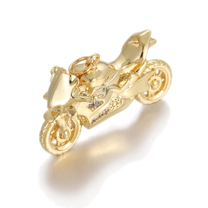 Macro detail of golden motorcycle pendant with inlaid white zircons and top ring