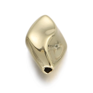 Macro shot of 14k gold-plated irregular geometric metal bead with smooth polished surface
