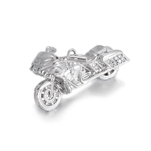 Detailed view of silver motorcycle pendant with white crystals and polished finish