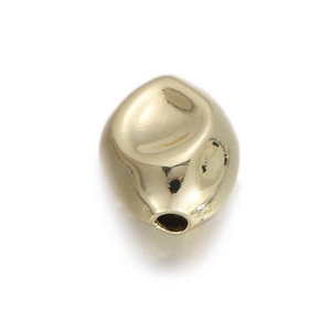 Close-up of irregular 14k gold plated copper spacer bead for DIY jewelry making