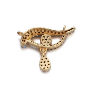 Gedetailleerd achteraanzicht van de gouden oogvormige hanger met honingraat metaaltextuur