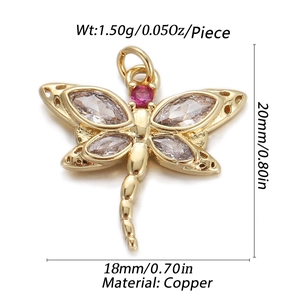 Detailed macro view of gold-plated copper dragonfly pendant with cubic zirconia stones
