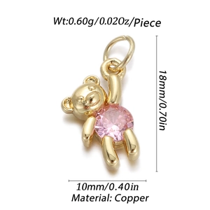 Detail view of bear pendant with pink zircon and size measurements 18mm by 10mm