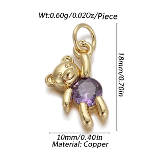 Detailed view of gold bear pendant with purple cubic zirconia, measuring 18mm x 10mm