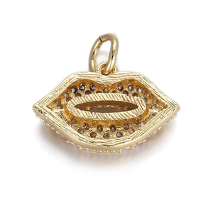 Detailed view of a gold-toned lip-shaped pendant with a textured hammered metal finish