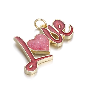 Detailed close-up of a gold LOVE pendant with pink glitter heart for DIY jewelry making