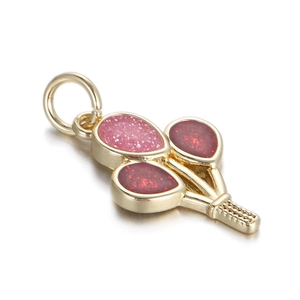 Detail of a gold balloon-shaped pendant with pink and red glitter enamel infill
