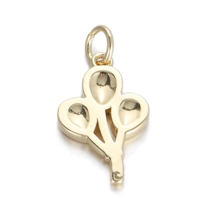 Macro detail of a triple golden balloon heart charm with a metallic polished finish