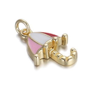 Detailed view of umbrella pendant with pink and red enamel on a gold metal base