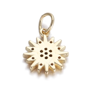 Macro view of a gold starburst pendant with a hollow center for DIY jewelry making