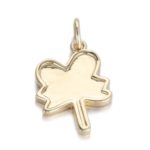 Detailed view of leaf-shaped gold metal pendant with polished finish and jump ring