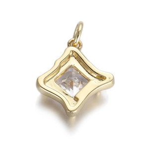Detail of a gold square zircon pendant with an asymmetric frame on a white background
