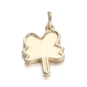 Macro shot of a golden clover-shaped pendant with smooth metallic finish and top ring bail