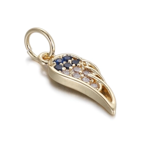 Detailed macro view of a golden wing pendant with inlaid blue and purple gemstones