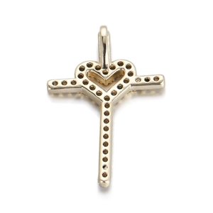 Detail of gold cross heart pendant with micro-pave cubic zirconia on white background