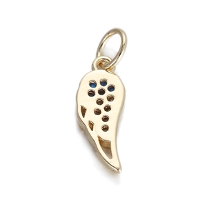Detailed view of a golden wing pendant with inlaid blue gems and polished finish