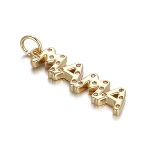 Close-up of golden MAMA letter pendant featuring micro-pave crystal inlay details