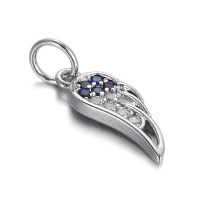 Close-up of angel wing pendant with blue gemstone cluster and pavé set white crystals