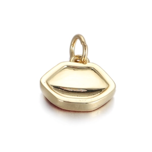 Close-up of a polished gold lip-shaped pendant charm for DIY jewelry making