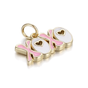 Detail of XOXO gold pendant with pink and white enamel and heart cutout design
