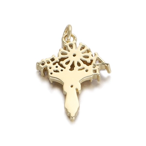 Detailed view of a golden sunburst medal charm with intricate hollow pattern and top ring