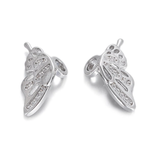 Macro detail of butterfly earrings with hollow wings and sparkling pave zircon stones