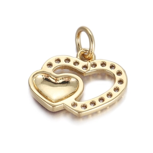 Macro detail of gold double heart pendant with cubic zirconia inlay for DIY jewelry