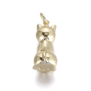 Macro shot of polished gold cat pendant with a smooth metallic finish and hanging ring