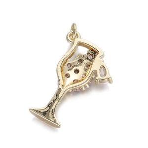 Detail of a gold cocktail glass pendant with light brown and clear crystals for jewelry making