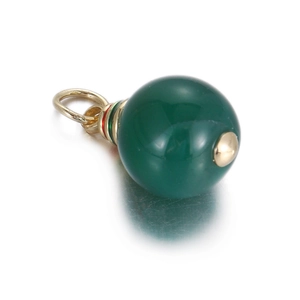 Macro detail of round dark green gemstone pendant with decorative gold bail and enamel ring