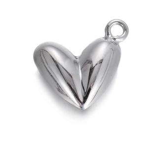 Polished silver heart pendant with geometric faceted design and metal ring connector