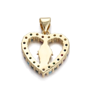 Detail of a golden heart religious pendant with colorful zircon stones and Mary silhouette