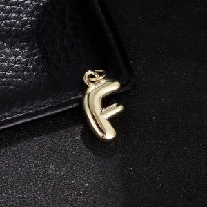 Polished gold bubble letter F pendant with 3D rounded edges and top jump ring detail