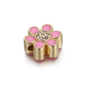 Detail of pink enamel flower charm with gold plating and cubic zirconia inlay