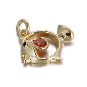 Detail of golden hollow fish pendant featuring a red gemstone and precise metalwork