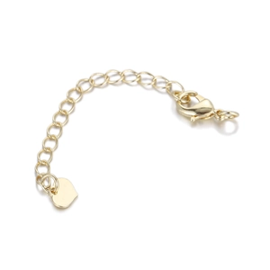 Detailed view of a gold-plated extension chain with lobster clasp and heart charm