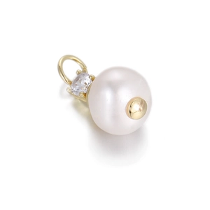 Detail of a 10mm white pearl pendant with a sparkling zircon inlay and 18K gold plated pin