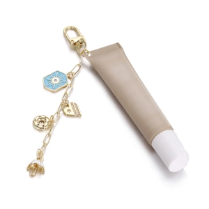 Porte-clés doré avec pendentifs en émail et cœur et tube de crème portable