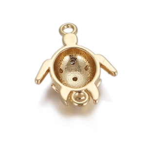Detailed view of a golden turtle connector charm for DIY jewelry with double loops