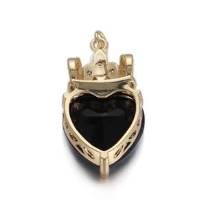 Golden crown heart pendant with large faceted black zircon gemstone on white background