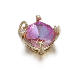 Macro view of pink cushion-cut zircon pendant with star-shaped prongs and heart cutout