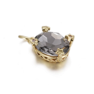 Detailed macro view of gray oval zircon pendant with star-shaped gold setting details