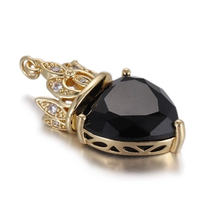 Golden crown heart pendant with black gemstone and white zircon inlays on mirror base