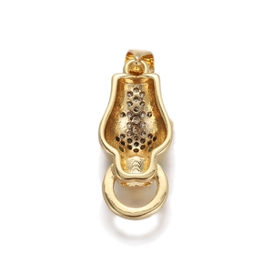 Macro view of gold panther pendant showing intricate honeycomb hollow back and fine metalwork